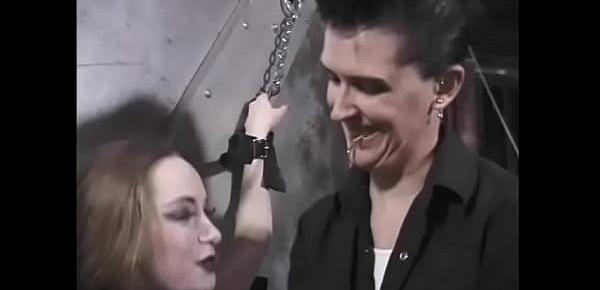  Dark-haired subbie in wrist restraints and nipple clamps punished in BDSM lair